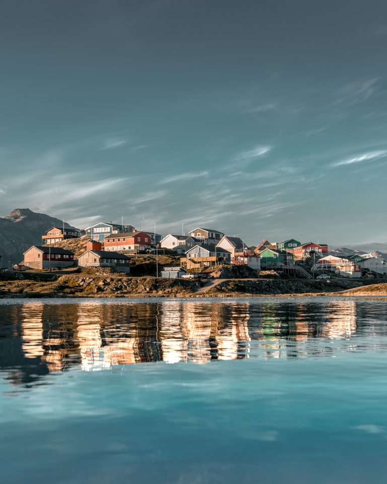 a-vertical-shot-of-colorful-houses-on-a-hill-refle-2026-01-11-10-09-48-utc