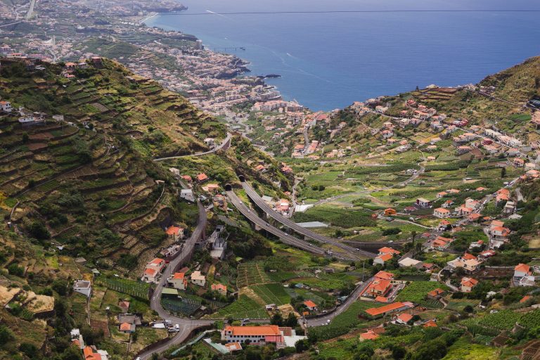 Travelling and exploring Madeira island landscapes and famous places. Summer tourism by Atlantic ocean and mountains. Outdoor views on beautiful water, sky, cliffs, coastline and travel destination.